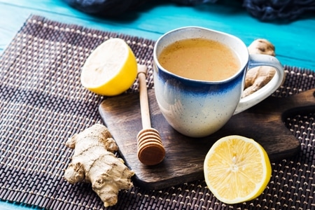Canva Lemon Ginger Hot Tea Drink with Honey as Natural Remedy